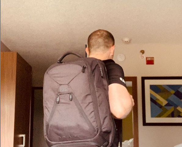 John using the expandable backpack